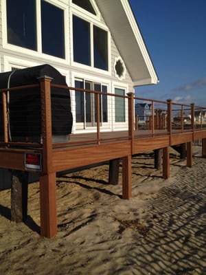 Mahogany deck with stainless steel Cable wire rail. Mahogany decking with stainless steel screws