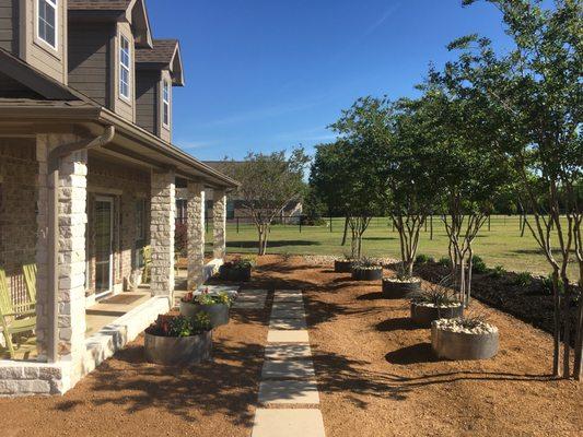 New Stone Walls, Regrading, Pavers, Decomposed Granite and custom steel planters (we want it too rust) with transplanted yuccas & flowers