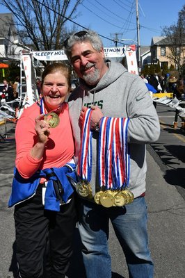 Showing off the custom medals made for Rivertown Runners at the Sleepy Hollow Half Marathon!