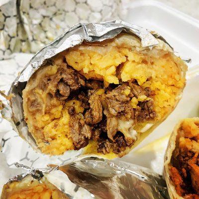 Rice, beans, cheese and steak burrito.