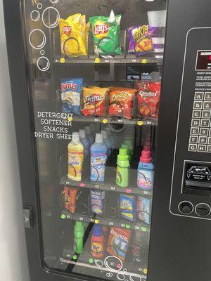 Vending machine with soap, detergent, softener, dryer sheets.