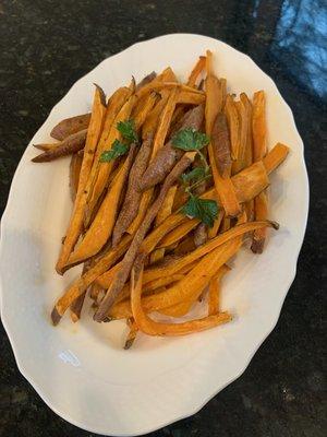 Lambert's sweet potatoes sliced and baked with drizzle of olive oil and fresh snipped parsley