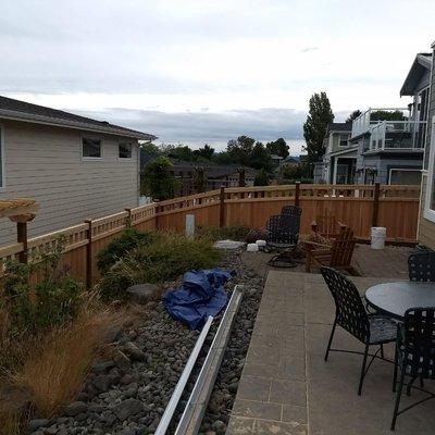 Ruston area fence. A look at the sloped side as it meets  the back line of fence where the trellis is built above the fence line.