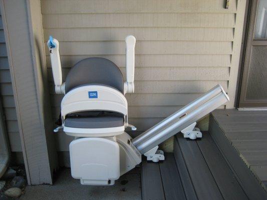 Exterior stairlift folded and out of the way