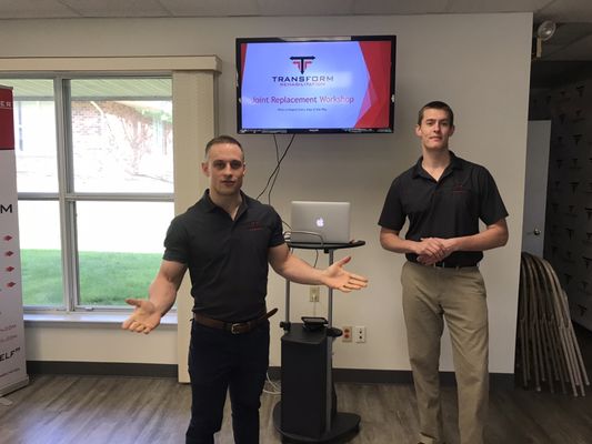 Thomas and Kyle hosting a seminar about joint replacements.