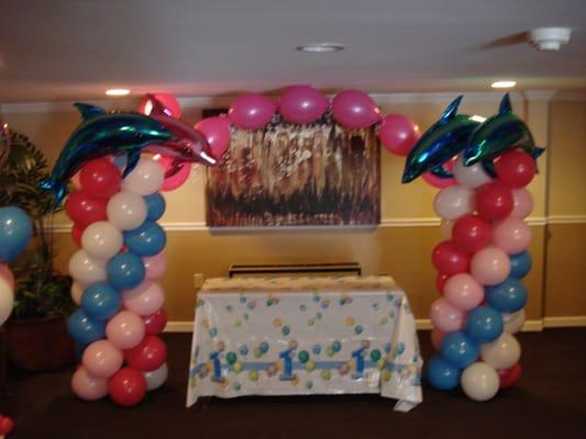 Under the sea columns for 1st birthday!  Jumping dolphins just add that extra touch!