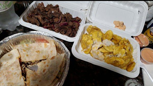 Steak con tostones and quesadillas