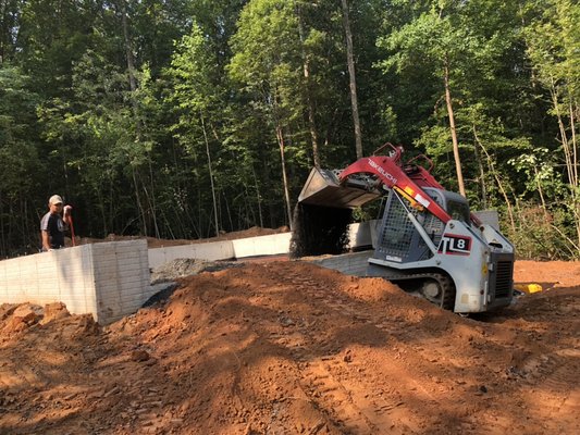 Our workers preparing garage & basement for concrete slabs.