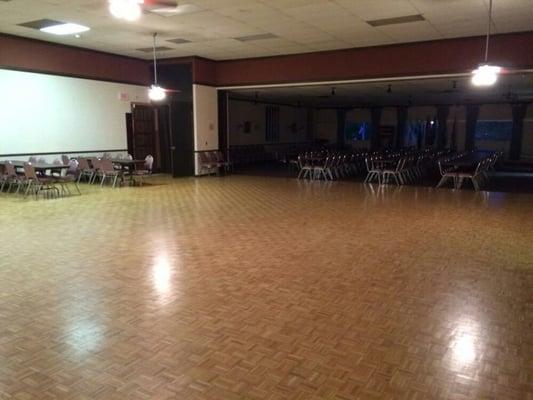 The main hall features a parquet dance floor.