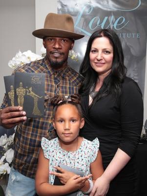 Actor Jamie Foxx and Meagan Holub, Celebrity Massage Therapist and Founder of The Love Institute at The Oscars Gift Suite.