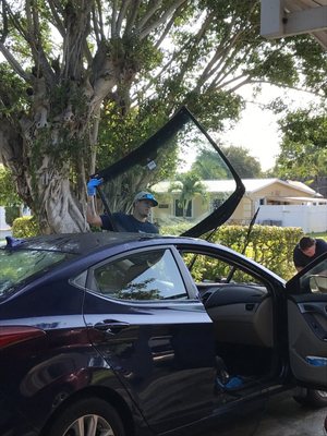 Jose removing old windshield