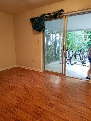 This is a plank style tile floor that Dee's Home Maintenance LLC installed in a eat in kitchen area.