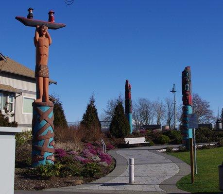 Totem poles at Centennial Riverwalk Park. Gifts from the Lummi Nation.