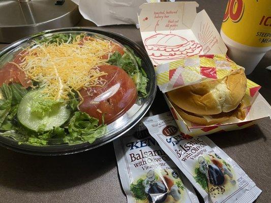 Chicken sandwich with side salad.