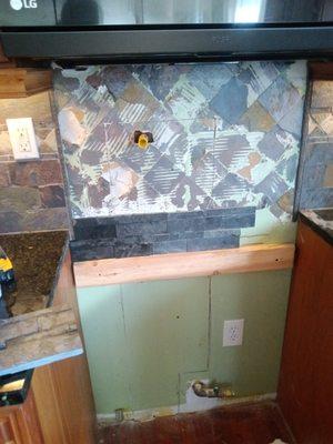 Added a new pot filler and tiled the backsplash