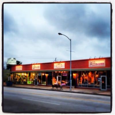 Storefront view of shops where Bliss on 19th is located.