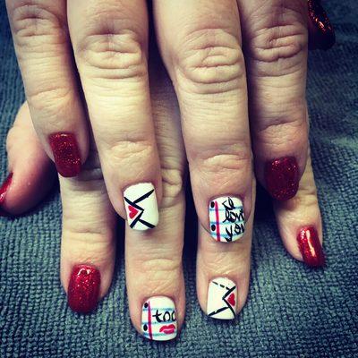 Gel polish with Valentine's Day nail art.