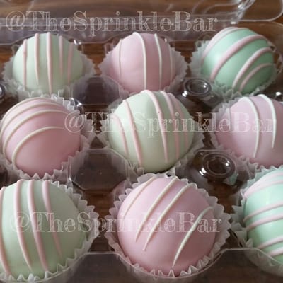 Strawberry and vanilla cake balls made to match a baby shower theme.