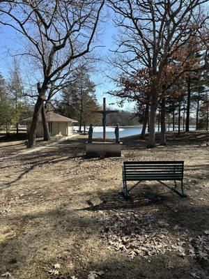 Hermitage and sitting bench overlooking lake.