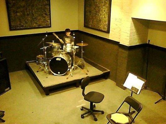 Isaac  studying drums at studio