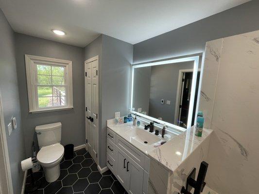 Removed popcorn ceiling and applied smooth finish, new floors, hung and finished new Sheetrock, as well as painted.