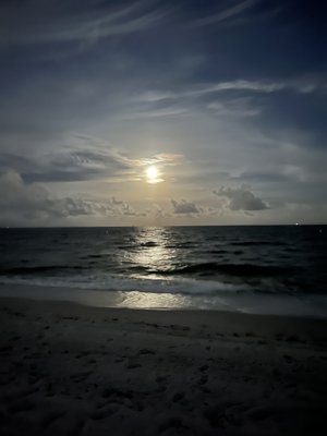 Beach area of Canada house at night with full moon