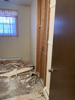 Tore out a wall and adding a new shower making the bathroom larger.