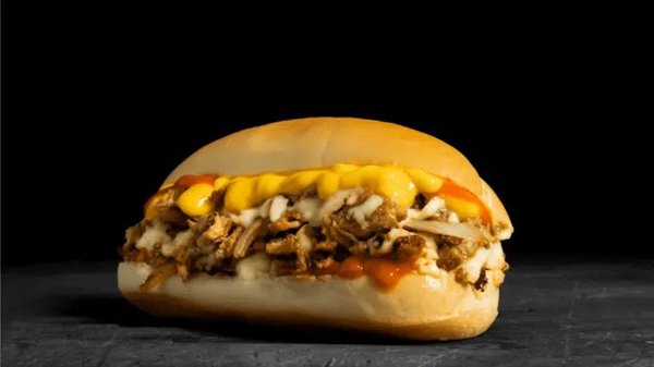 Buffalo Chicken Cheesesteak: Thinly sliced chicken, provolone, cheddar sauce, griddled onions, spicy buffalo sauce on a toasted hoagie roll