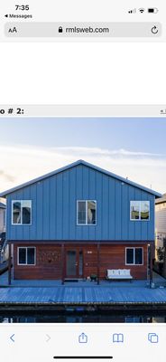 Exterior elevation view of a custom, modern floating home on the Columbia River.