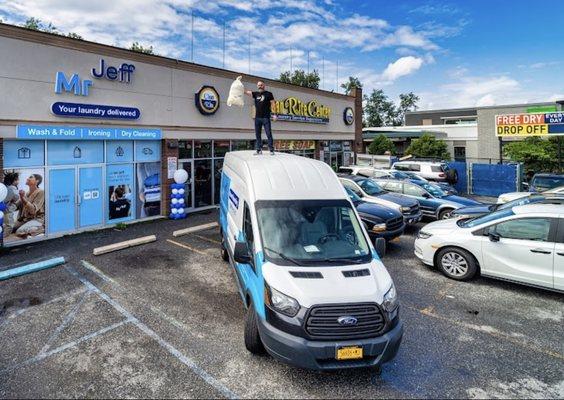 Storefront, parking lot, and company van.