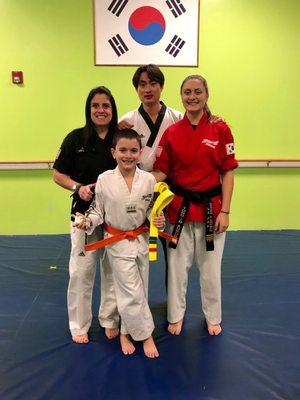 Group picture  leveled up and earned his orange belt