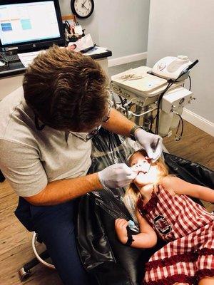 We get asked all the time if Dr. Camp sees kids and if the team is good with them. Here's a 2 year old patient at her first dental visit.