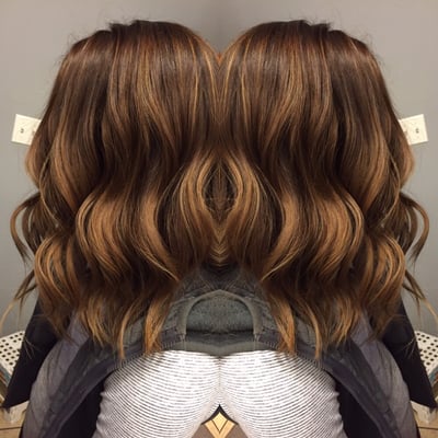 Looking to add dimension into her existing color. We added some balyage & ombre & toned to a Carmel brown!