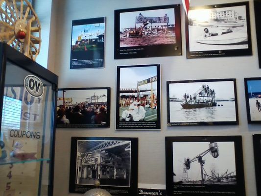 A mix of black-and-white and color photos of Ocean View on another museum wall