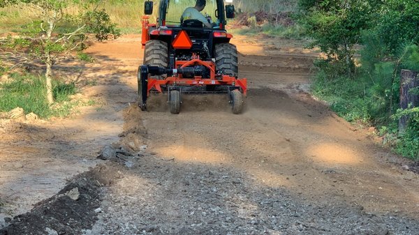 preparing the seedbed with our power rake