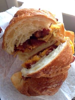 Bacon, egg, and cheddar on a croissant.