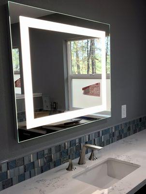 Robern LED mirror with Brizo's Sotria faucet set and St. Thomas square sink