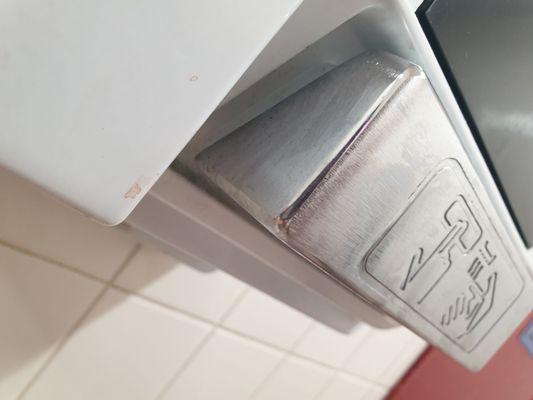 blood on hand dryer button