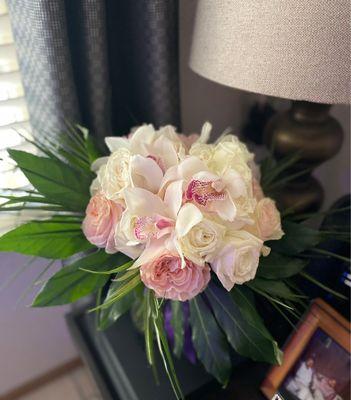 Bridal bouquet. Orchid and blush roses with tropical greenery.