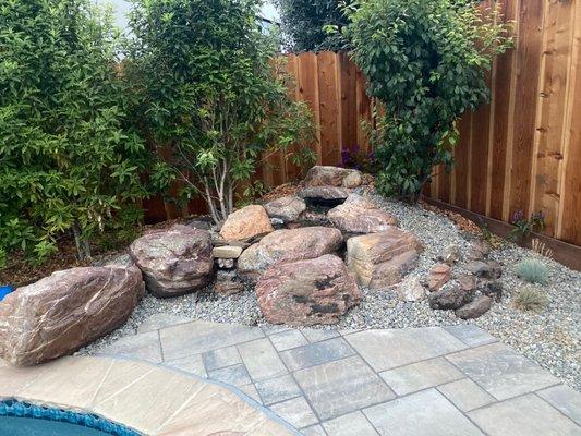 Waterfall feature,  kid-proof,  makes a lovely sound of a creek in the back yard.