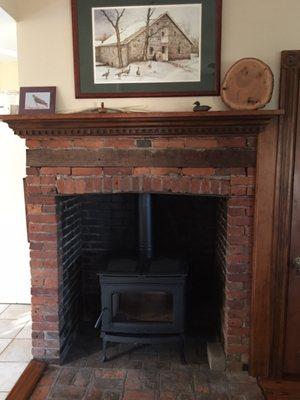 Our new wood burning stove heating our home from what was an unusable fireplace.