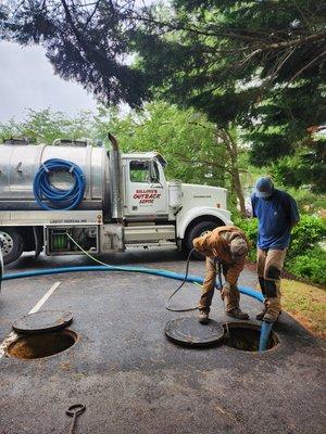 Pumping and cleaning septic tanks