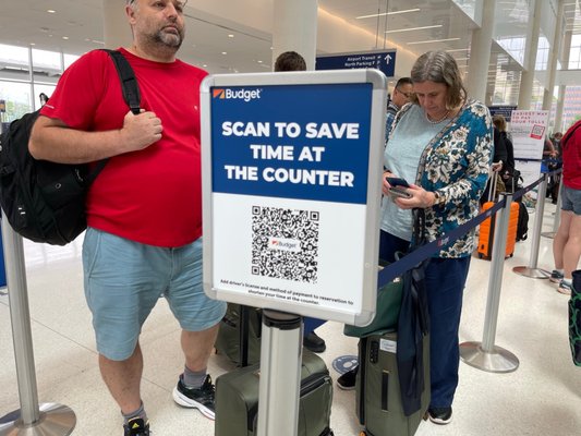 You can scan this QR code while you're in line to save time at the counter.