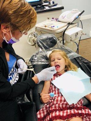 We get asked all the time if Dr. Camp sees kids and if the team is good with them. Here's a 2 year old patient at her first dental visit.