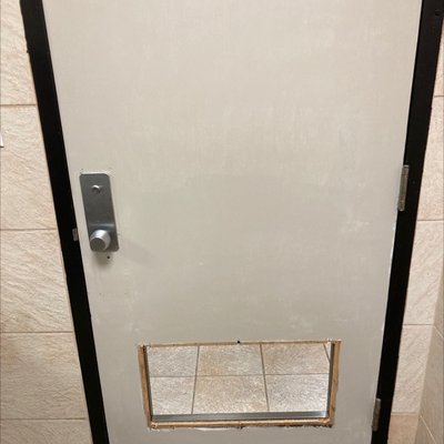 The bathroom door is literally missing a piece.