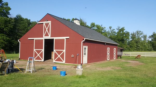 This is a barn we stained using Benjamin Moore Arborcoat. We also painted the trim.