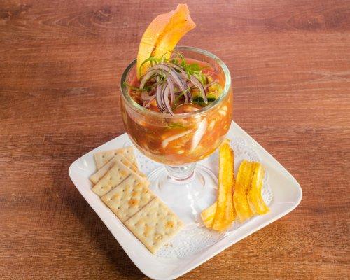 Coctel de Camaron- Shrimp cocktail with pico de gallo, cilantro, avocado, cucumber, and crackers.