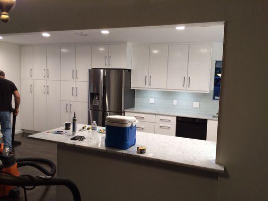 White slab front euro style custom kitchen.