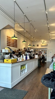 a very linear layout of the shop, from outside seating, serving counter to the back shelving area