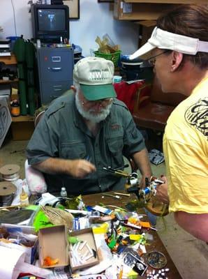 Jim Swann palmers a hackle for a flip flop fly.